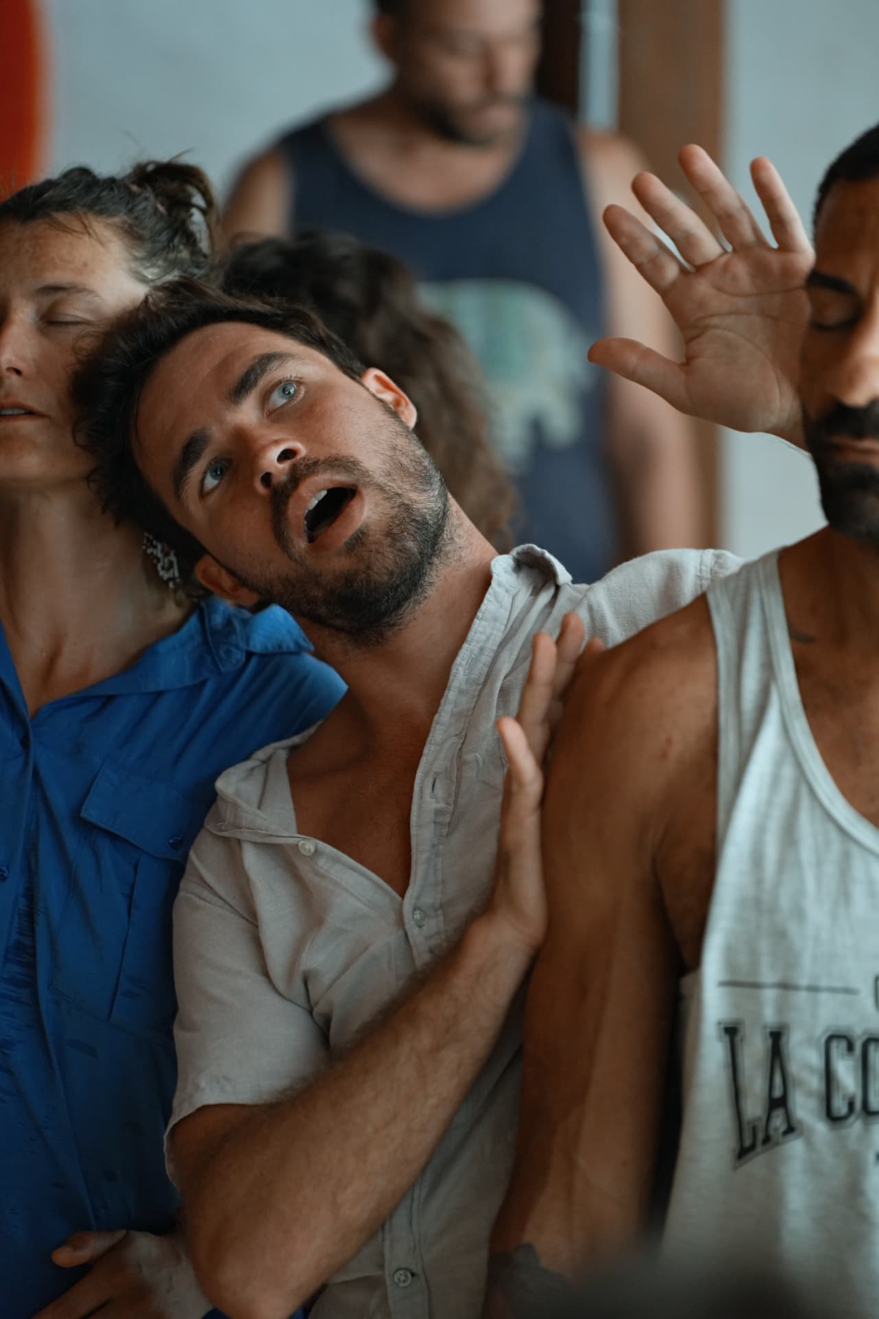 Participants in expressive movement during a group session